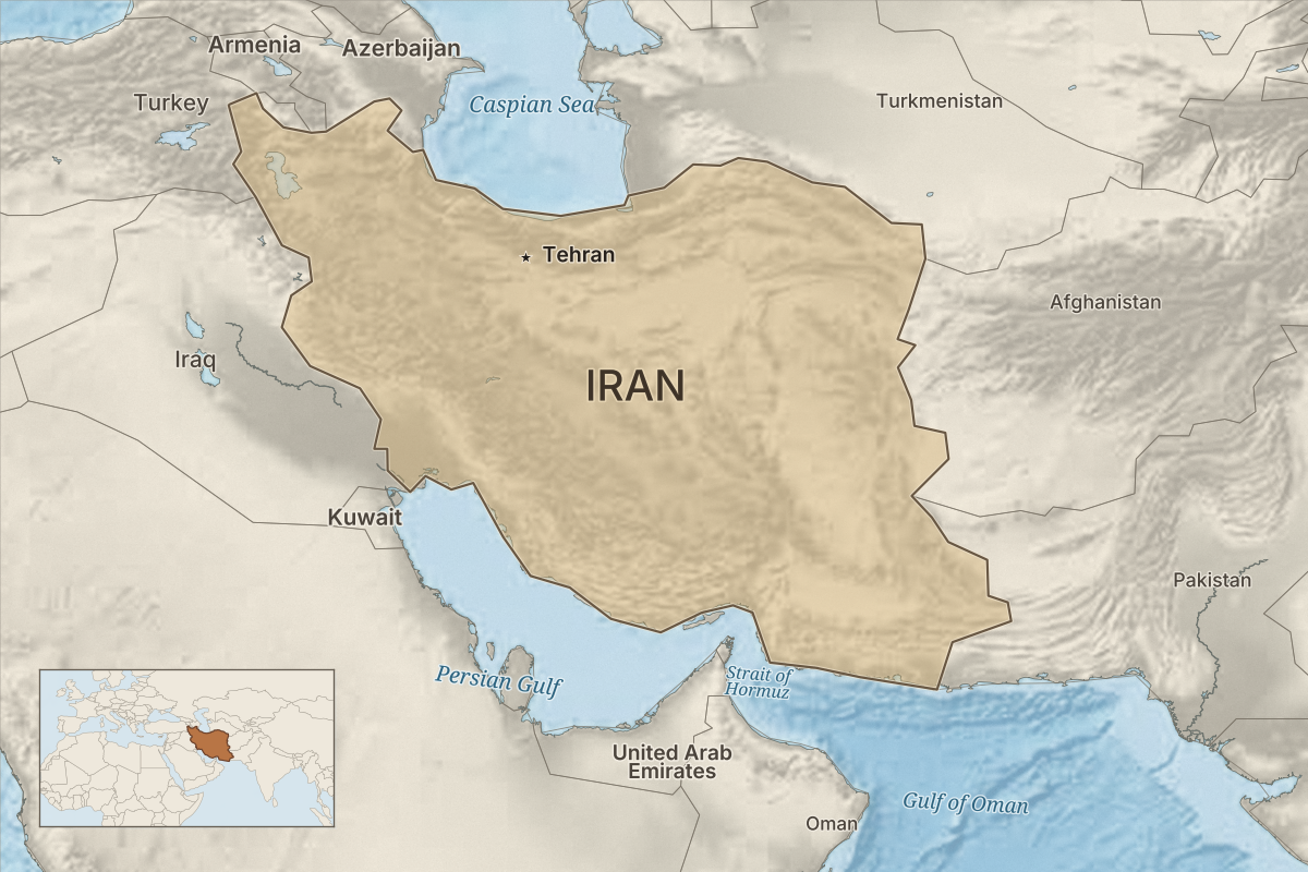 Map of Iran showing Tehran, neighbouring countries, the Caspian Sea, Persian Gulf, Strait of Hormuz and Gulf of Oman, with a wider regional locator.
